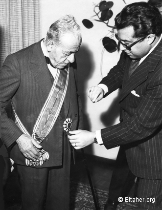 1974 - Ambassador Salaheddin Abdallah adjusting Eltahers decoration